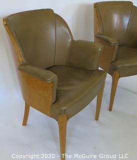 Two Vintage English Club Chairs with Leather Upholstery and Birds-Eye Maple Veneer, circa 1936.  Small amount of delamination on top ridge of one chair as shown. Outside arm to arm width 25.5"; inside seat to seat width 17", seat depth 18.5", seat height 19.5", height at back 35.5")