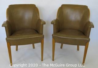 Two Vintage English Club Chairs with Leather Upholstery and Birds-Eye Maple Veneer, circa 1936.  Small amount of delamination on top ridge of one chair as shown. Outside arm to arm width 25.5"; inside seat to seat width 17", seat depth 18.5", seat height 19.5", height at back 35.5")