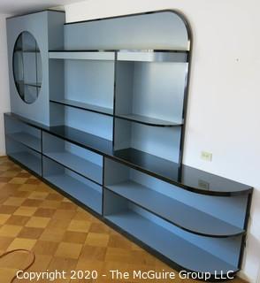 Reproduction Art Deco Style Shelving Unit. Made of Grey Laminate with Wood Substrate. Top shelf has built in lighting. Designed to resemble display shelves of the Chase giftware department at many prominent retailers in the 1930's, including Gimbels. 168" wide x 91"T  