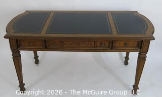 Embossed Leather Topped Fruitwood Writing Desk with three drawers and gilt Decoration, Made in France; 60W x 27D x 30"T