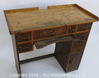 Industrial Wood Jeweler's Desk or Watchmakers Work Bench with Railings, Drawers in Range of Sizes to Keep Tools Organized and Catch Tray for catching bench sweeps.  Some Damage to Base. 40"W x 20"D x 36"T