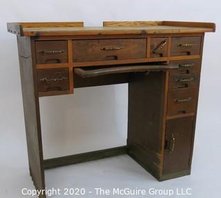 Industrial Wood Jeweler's Desk or Watchmakers Work Bench with Railings, Drawers in Range of Sizes to Keep Tools Organized and Catch Tray for catching bench sweeps.  Some Damage to Base. 40"W x 20"D x 36"T