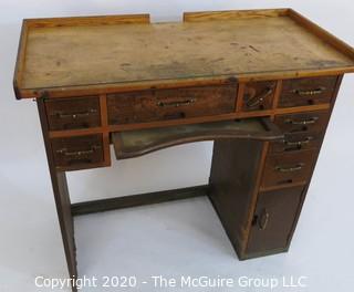 Industrial Wood Jeweler's Desk or Watchmakers Work Bench with Railings, Drawers in Range of Sizes to Keep Tools Organized and Catch Tray for catching bench sweeps.  Some Damage to Base. 40"W x 20"D x 36"T