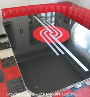 Furniture: 1950's style "Diner" booth with two-piece corner banquette, 2 red stools, 2 black stools and glass topped chrome table on 4 pedestal feet.  Table is 48" x 68" x 31"T; Banquette is 73" end to wall x 90" end to wall. Banquette is 30.5" tall at back x 17.5" seat height.  Stools are 21"T. Note: photo shows 1.5" worn banquette seat.   