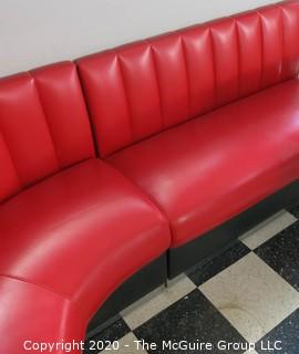 Furniture: 1950's style "Diner" booth with two-piece corner banquette, 2 red stools, 2 black stools and glass topped chrome table on 4 pedestal feet.  Table is 48" x 68" x 31"T; Banquette is 73" end to wall x 90" end to wall. Banquette is 30.5" tall at back x 17.5" seat height.  Stools are 21"T. Note: photo shows 1.5" worn banquette seat.   