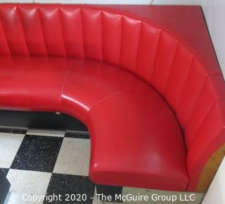 Furniture: 1950's style "Diner" booth with two-piece corner banquette, 2 red stools, 2 black stools and glass topped chrome table on 4 pedestal feet.  Table is 48" x 68" x 31"T; Banquette is 73" end to wall x 90" end to wall. Banquette is 30.5" tall at back x 17.5" seat height.  Stools are 21"T. Note: photo shows 1.5" worn banquette seat.   