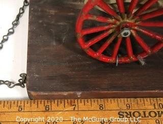 Vintage Cast Iron Fire Ladder Carriage Toy Mounted on Board.  Measures approximately 31" long with chains to attach to ceiling. 