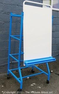 Shared Reading Center Metal Easel on Rolling Stand Made by Copernicus Educational Products.  To be used with Dry Erase Markers with detachable marker tray.  Measures approximately 64" tall.