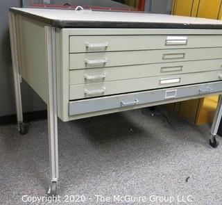 Industrial Steel Flat File Table with Five Drawers on Legs with Casters.  Measures approximately 57" x 38" x 39".