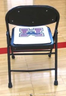 Padded Metal Folding Chair with George Mason Logo.  Used as Home Basketball Team Seating in the Pit