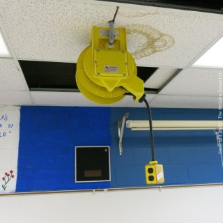 Daniel Woodhead 600V Model 9383 Industrial Grade Ceiling Mounted Retractable Electrical Cord Reel;  12/3 SOW-A 90C (Unit has been disconnected from power source, but still requires disassembly from ceiling by buyer) 