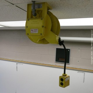 Daniel Woodhead 600V Model 9383 Industrial Grade Ceiling Mounted Retractable Electrical Cord Reel;  12/3 SOW-A 90C (Unit has been disconnected from power source, but still requires disassembly from ceiling by buyer)