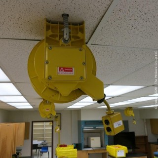 Daniel Woodhead 600V Model 9383 Industrial Grade Ceiling Mounted Retractable Electrical Cord Reel;  12/3 SOW-A 90C (Unit has been disconnected from power source, but still requires disassembly from ceiling by buyer)