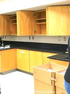 Science room tables and cabinetry. You must disassemble and remove what items you want.