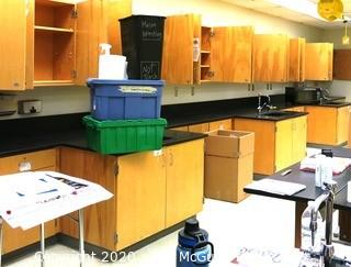 Science room tables and cabinetry. You must disassemble and remove what items you want.