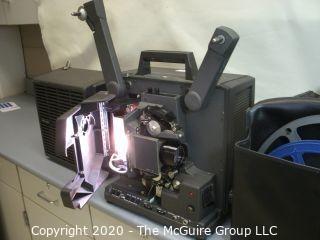 Bell & Howell Model 1268, 16mm film projector, w/carrying cover and reels. As is.