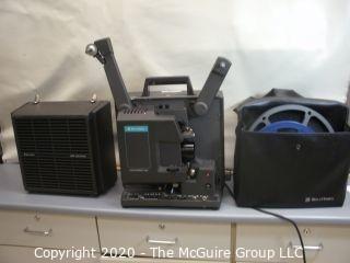 Bell & Howell Model 1268, 16mm film projector, w/carrying cover and reels. As is.