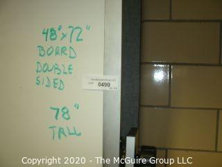 Double sided white board on casters, 48" x 72" and 78" tall (a few dings)