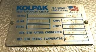 Kolpack Walk In Cooler S/N 32790970R.  Condenser is on the outside of building.  Interior measures approximately 14' x 9'.  Description altered 12/28 at 5:03 EST.