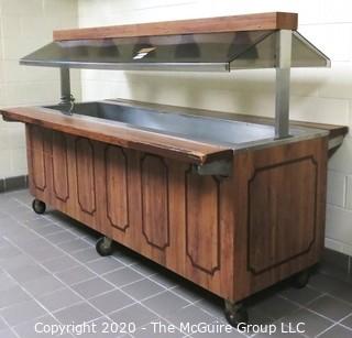 Buffet serving station on casters with overhead lights