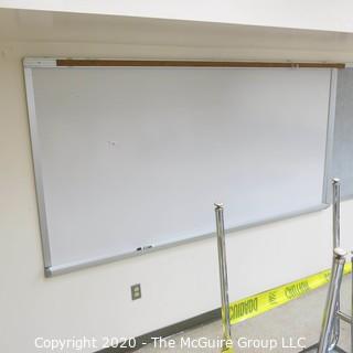 4' X 8' WHITE BOARD IN METAL FRAME (BUYER TO REMOVE FROM WALL)