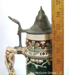 Antique German Porcelain Stein with Pewter lid. Measures approximately 15" tall.