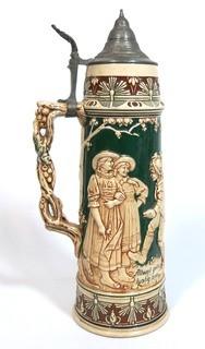 Antique German Porcelain Stein with Pewter lid. Measures approximately 15" tall.