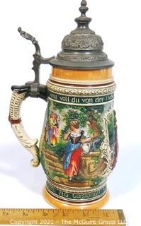 Vintage German Pottery Beer Stein with Pewter Hinged Lid.  Measures approximately 10" tall.