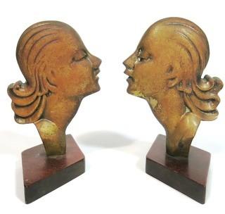 Pair of Art Deco Female Busts in Profile Relief Mounted on Wood Base. Possibly D. H. Chiparus.  Measures approximately 7 1/2" tall