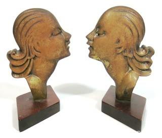 Pair of Art Deco Female Busts in Profile Relief Mounted on Wood Base. Possibly D. H. Chiparus.  Measures approximately 7 1/2" tall