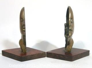 Pair of Art Deco Female Busts in Profile Relief Mounted on Wood Base. Possibly D. H. Chiparus.  Measures approximately 7 1/2" tall