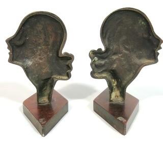 Pair of Art Deco Female Busts in Profile Relief Mounted on Wood Base. Possibly D. H. Chiparus.  Measures approximately 7 1/2" tall