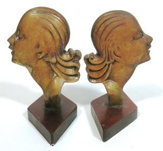 Pair of Art Deco Female Busts in Profile Relief Mounted on Wood Base. Possibly D. H. Chiparus.  Measures approximately 7 1/2" tall