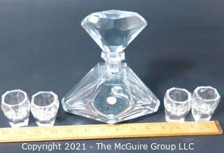 Clear Glass Liquor Decanter with Four Matching Glasses.  Chip on lip of decanter.