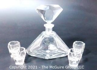 Clear Glass Liquor Decanter with Four Matching Glasses.  Chip on lip of decanter.