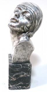 Heavy Cast Bronze with Silver Overlay Art Deco Statue of Female Bust on Marble Base made and Signed by H. G. Miller, 1928.  Measures approximately 10" tall. 