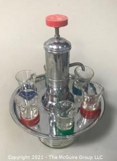 Fun Mid Century Liquor Decanter with Pump Dispenser and  Six Glasses on Base.   Measures approximately 12" tall.