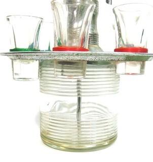 Fun Mid Century Liquor Decanter with Pump Dispenser and  Six Glasses on Base.   Measures approximately 12" tall.