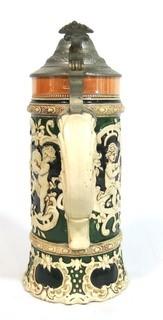 Antique German Porcelain Stein with Pewter lid. Measures approximately 10" tall.