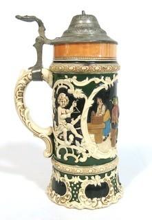 Antique German Porcelain Stein with Pewter lid. Measures approximately 10" tall.