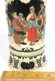 Antique German Porcelain Stein with Pewter lid. Measures approximately 10" tall.