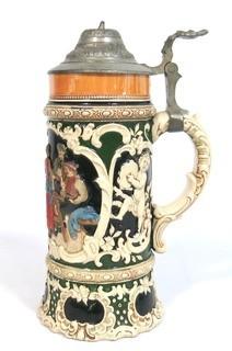 Antique German Porcelain Stein with Pewter lid. Measures approximately 10" tall.