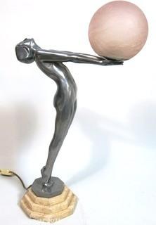 Art Deco Pewter Lamp of Woman with Outstretched Arms Holding Pink Glass Globe Shade on Marble Base.  Measures approximately 25" tall.  