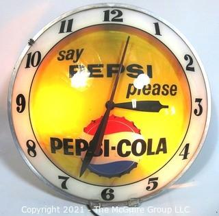 Vintage Deco Light Up Electric Pepsi Wall Clock.  Measures approximately 15" in diameter with convex glass lens and is in working condition