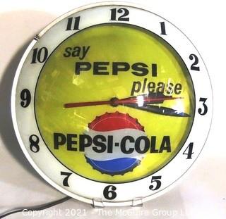 Vintage Deco Light Up Electric Pepsi Wall Clock.  Measures approximately 15" in diameter with convex glass lens and is in working condition