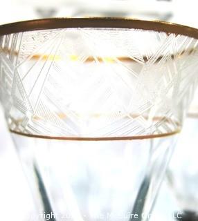 (24) Piece Set of Etched Crystal Glassware with Gilt Edge and Black Open work Base.  