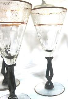 (24) Piece Set of Etched Crystal Glassware with Gilt Edge and Black Open work Base.  