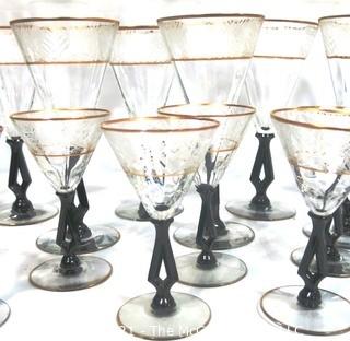 (24) Piece Set of Etched Crystal Glassware with Gilt Edge and Black Open work Base.  