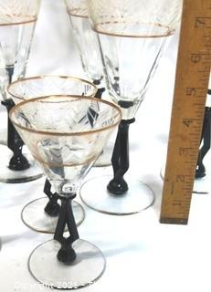 (24) Piece Set of Etched Crystal Glassware with Gilt Edge and Black Open work Base.  