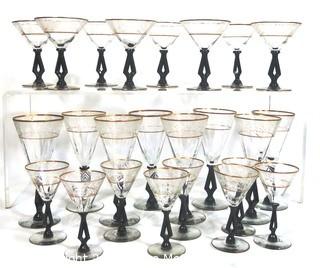 (24) Piece Set of Etched Crystal Glassware with Gilt Edge and Black Open work Base.  